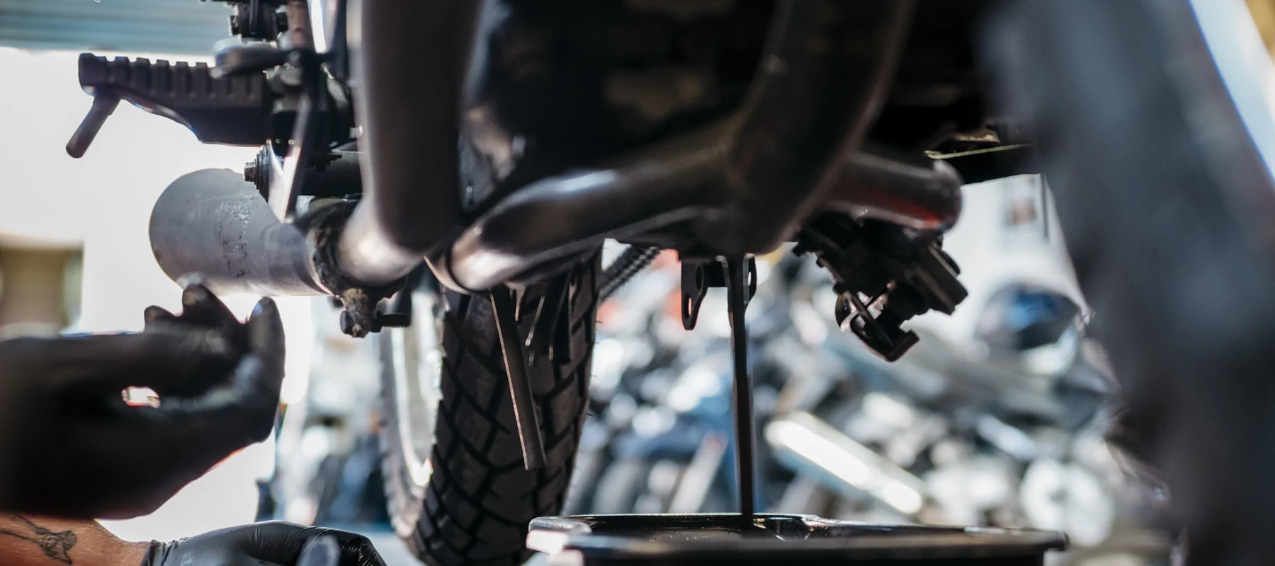 Technician Changing Oil